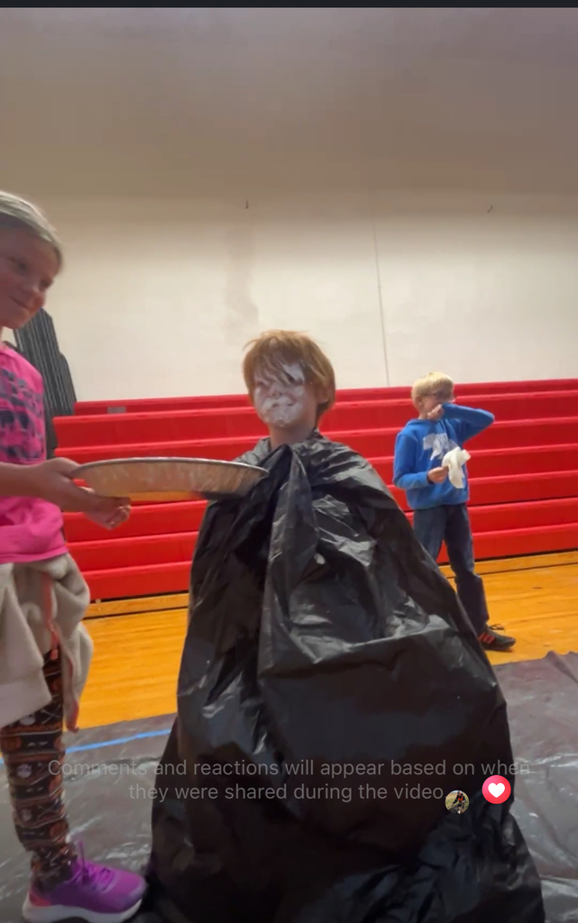 Student pieing teacher