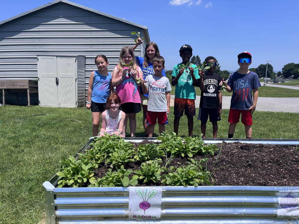 students with the radishes they harvested.