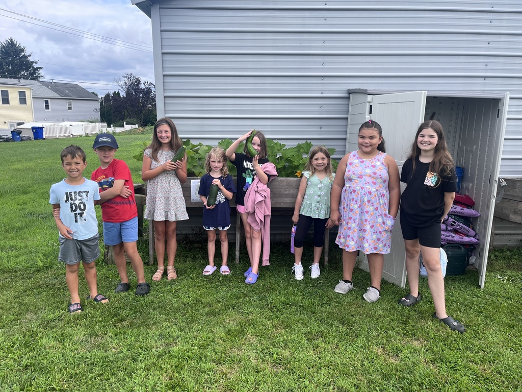 students with the zucchini they grew