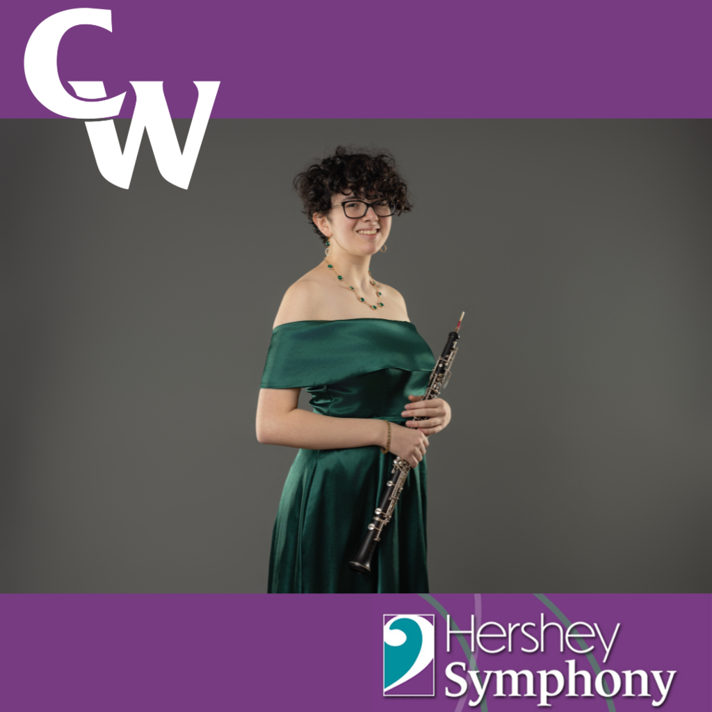 student holding oboe