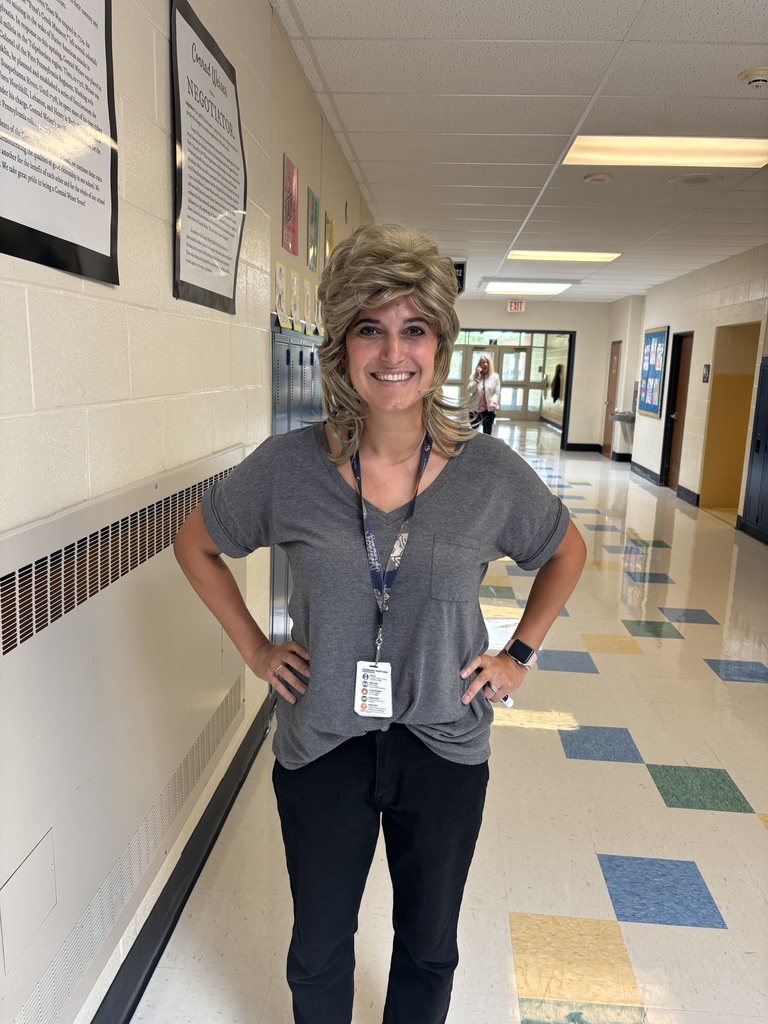 teacher posing with crazy hair