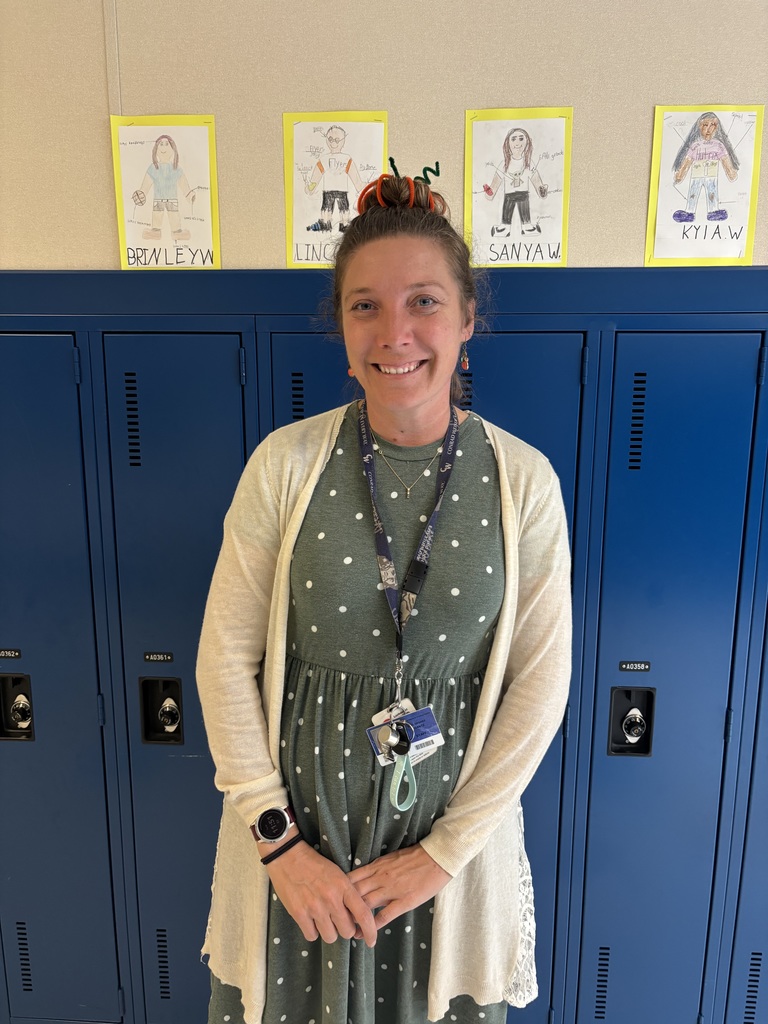 teacher posing with crazy hair