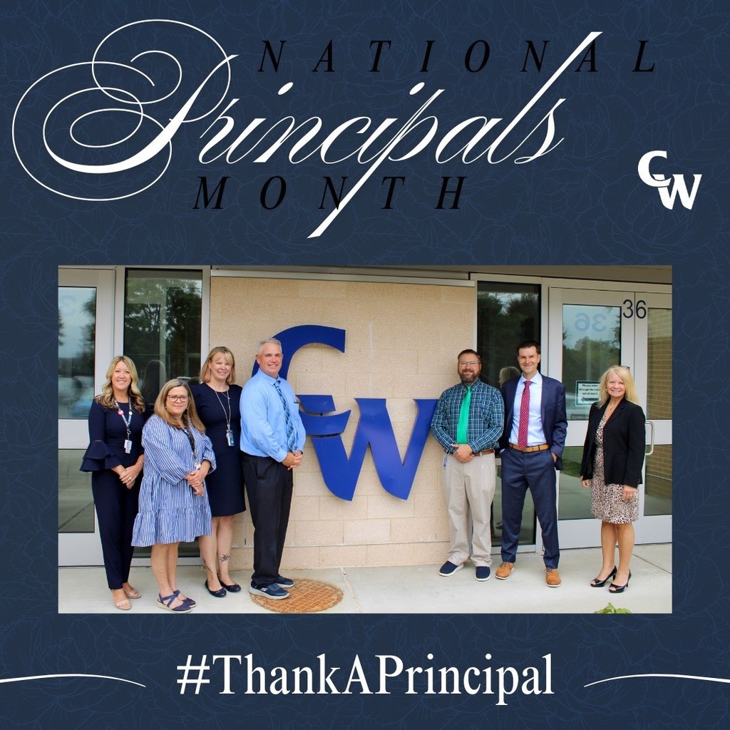 photo taken outside of all building principals, CW in the background