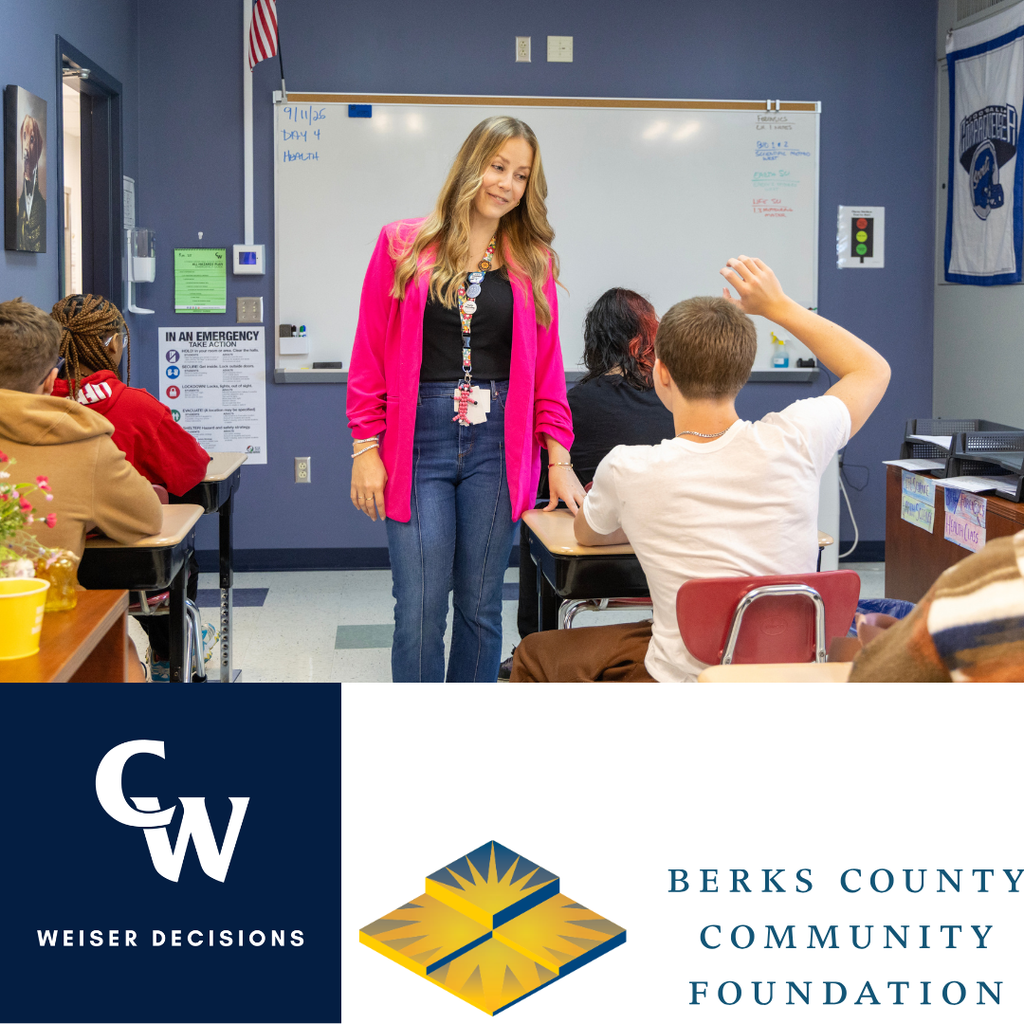 Social Worker walking classroom with students
