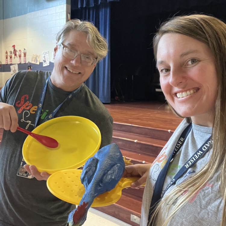 two teachers with physical education equipment