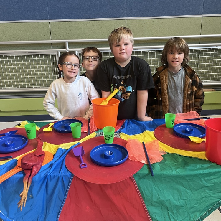 students with their table for Thanksgiving dinner