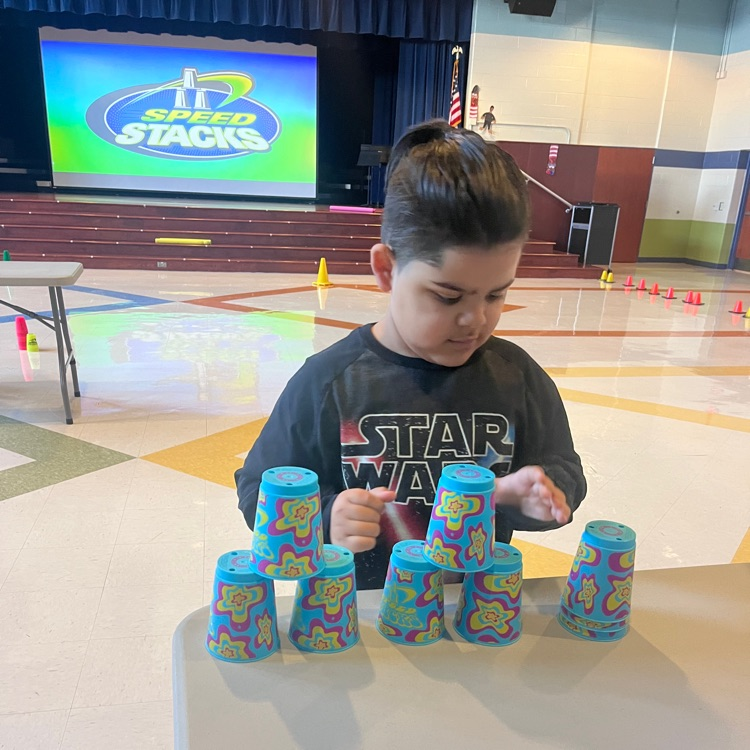 student working with speed stacks