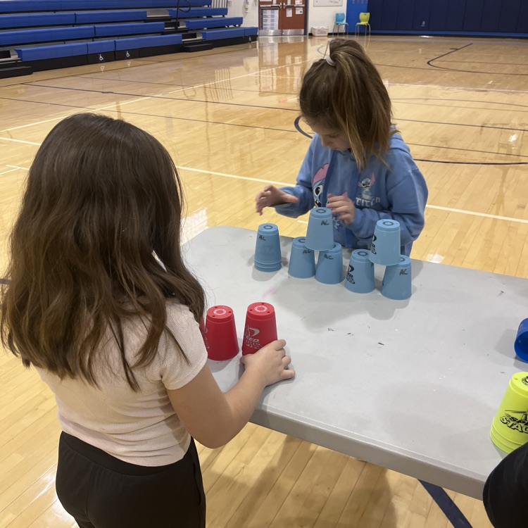 student working with speed stacks