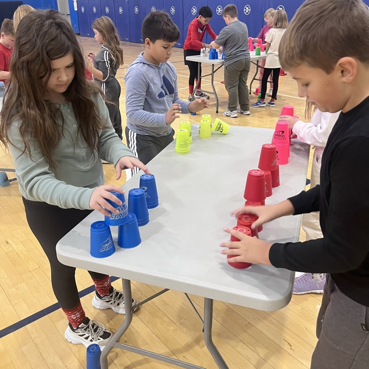 student working with speed stacks