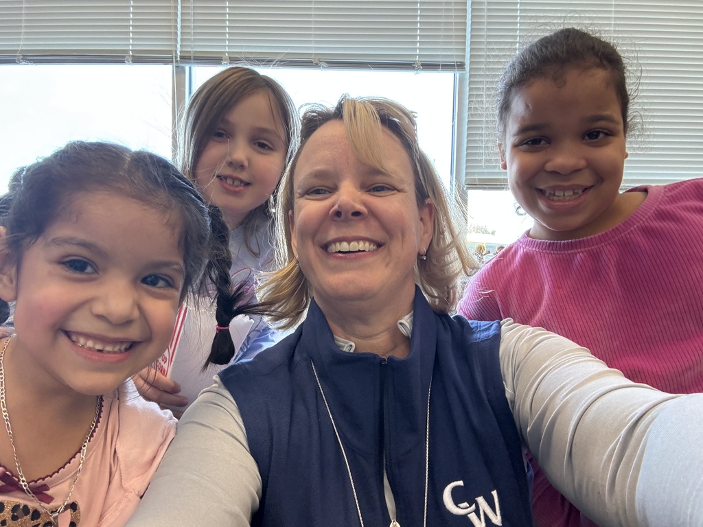 three female students and the principal