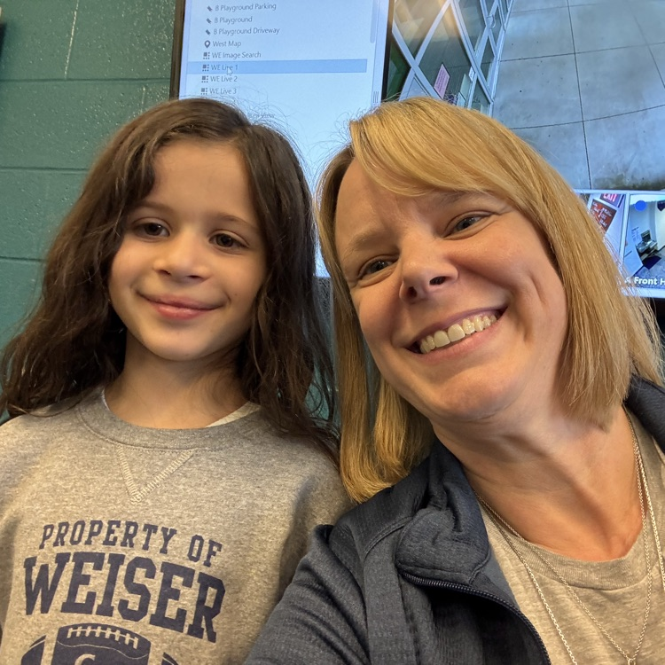 student(s) with principal eating popcorn 