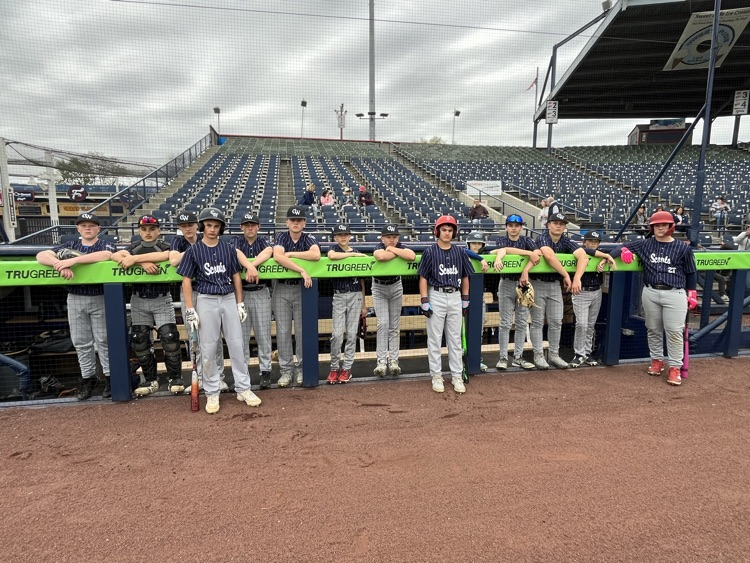 CWMS  baseball team lined up at a dugout