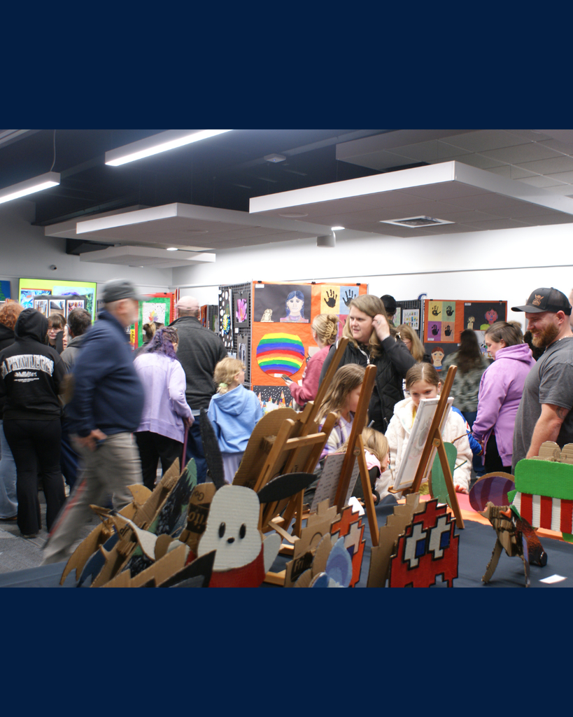 Photographs of families and community members viewing student artwork at the District Wide art show