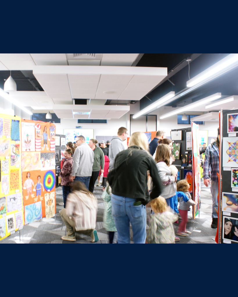 Photographs of families and community members viewing student artwork at the District Wide art show