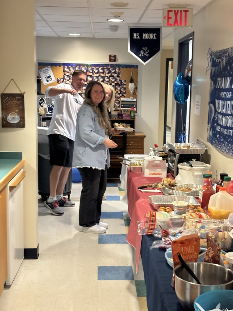 staff getting food at a table 