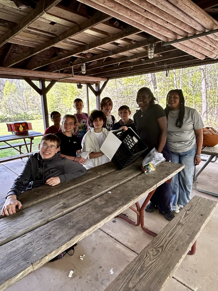 students sitting at a picnic bench