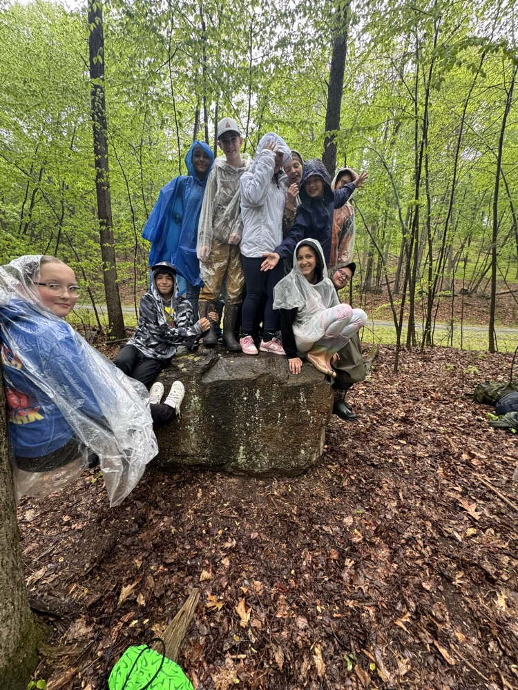 many students on a rock