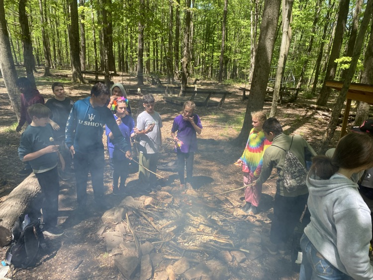 students at a campfire