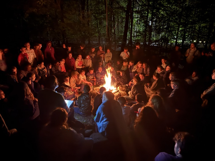 students at a campfire