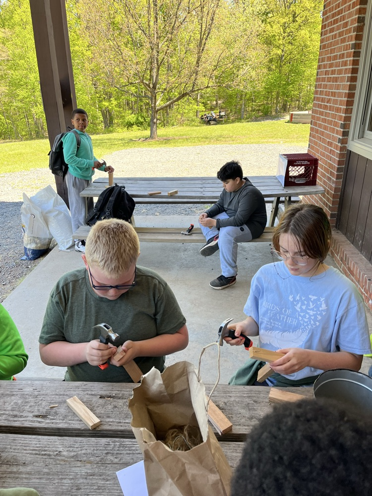 students working on a bird box while at NEED Camp
