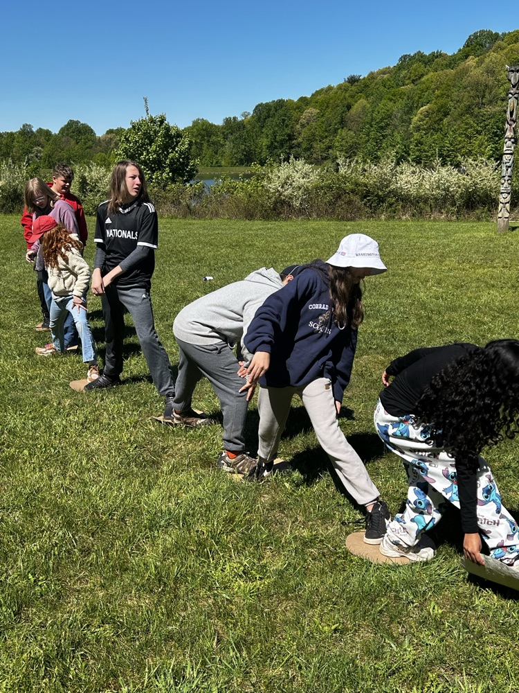 students playing a team work building game
