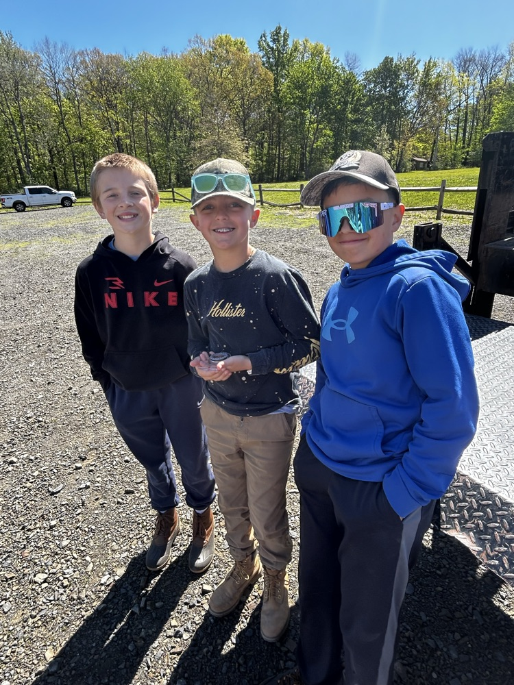 students using a compass on an orienteering course