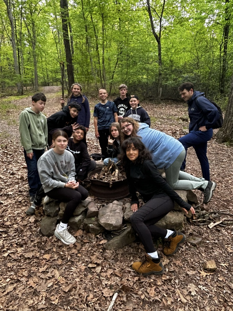 students making a fire to cook with