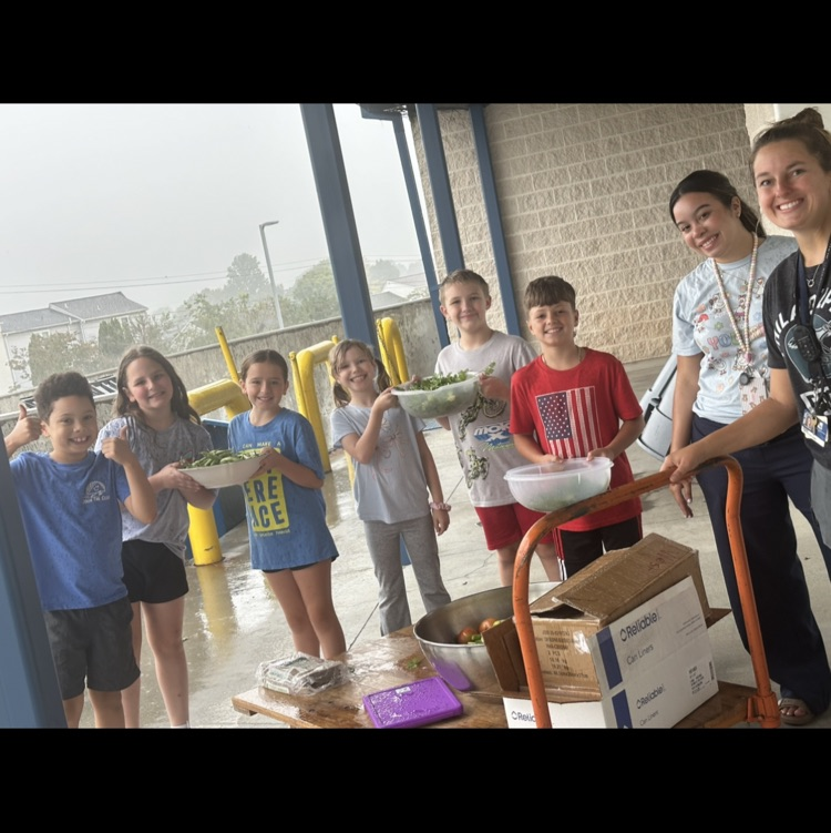 students and two teachers with the crops we harvested