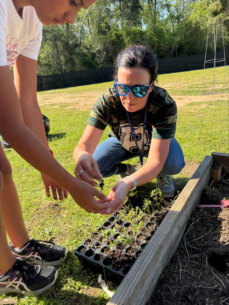 Mrs. I helping a gardener
