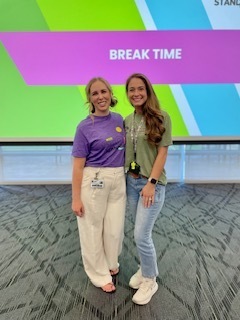 two teachers standing