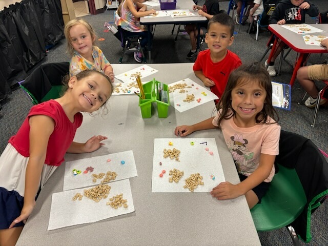 Students in Ms. Moore's class had fun sorting based on color and shape in science today!