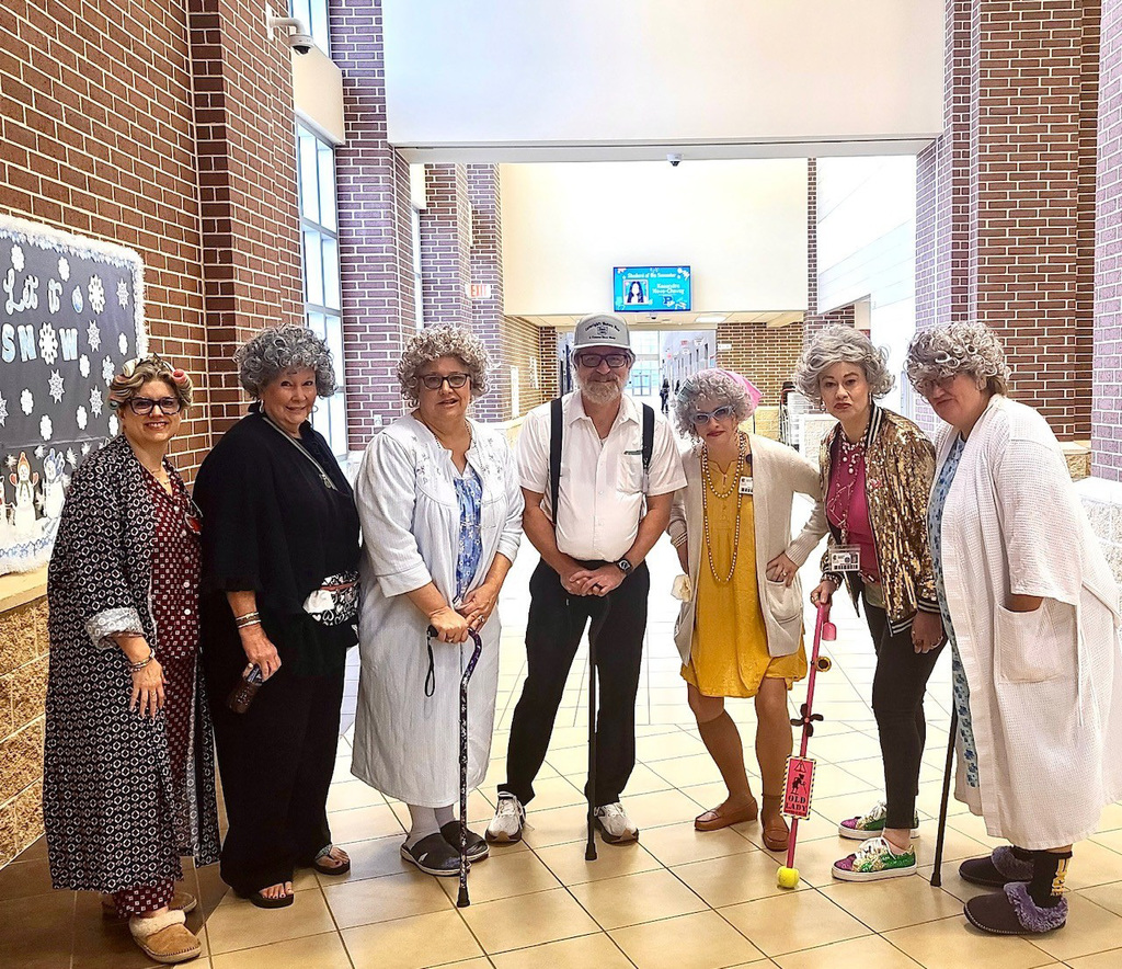 Staff group photo from the 100th Day of School celebration.