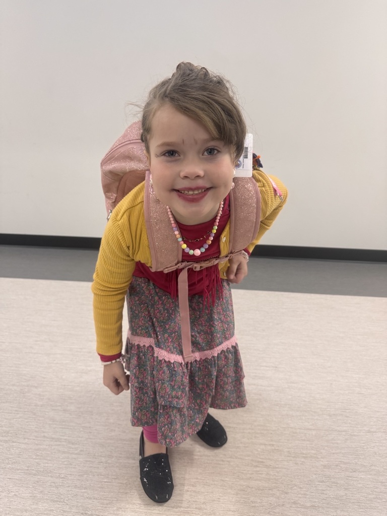 An elementary student dressed up for the 100th Day of School.