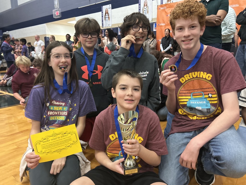 DI Students with trophy. 