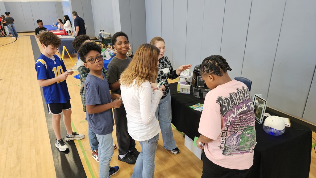 6th grade students visiting a career fair vendor