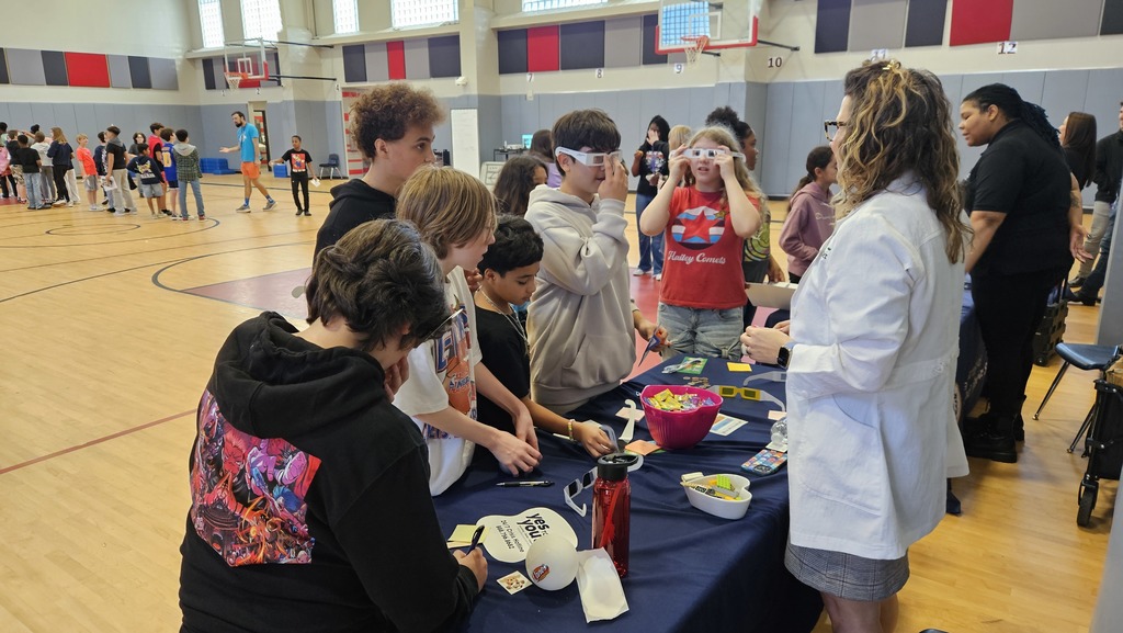 6th grade students visiting a career fair vendor