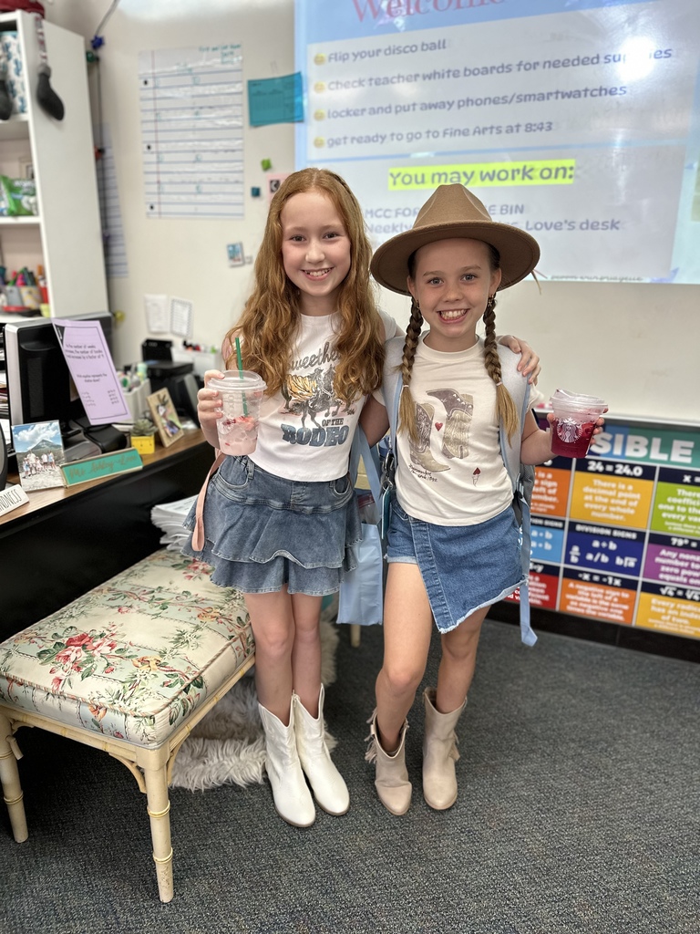 Students posing in Western-themed outfits.