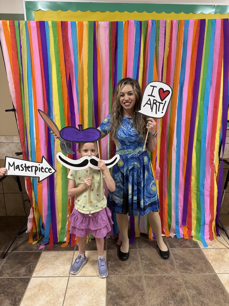 kid with teacher at art night