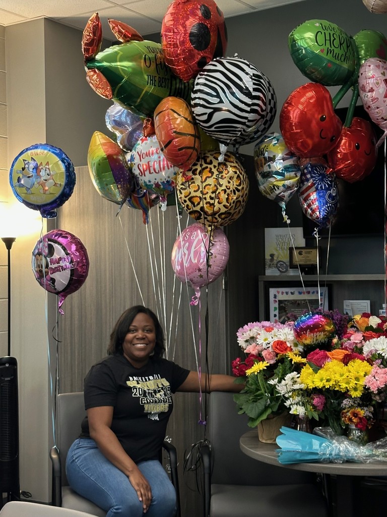 Mrs. Smith with some of her treats from the staff and students.