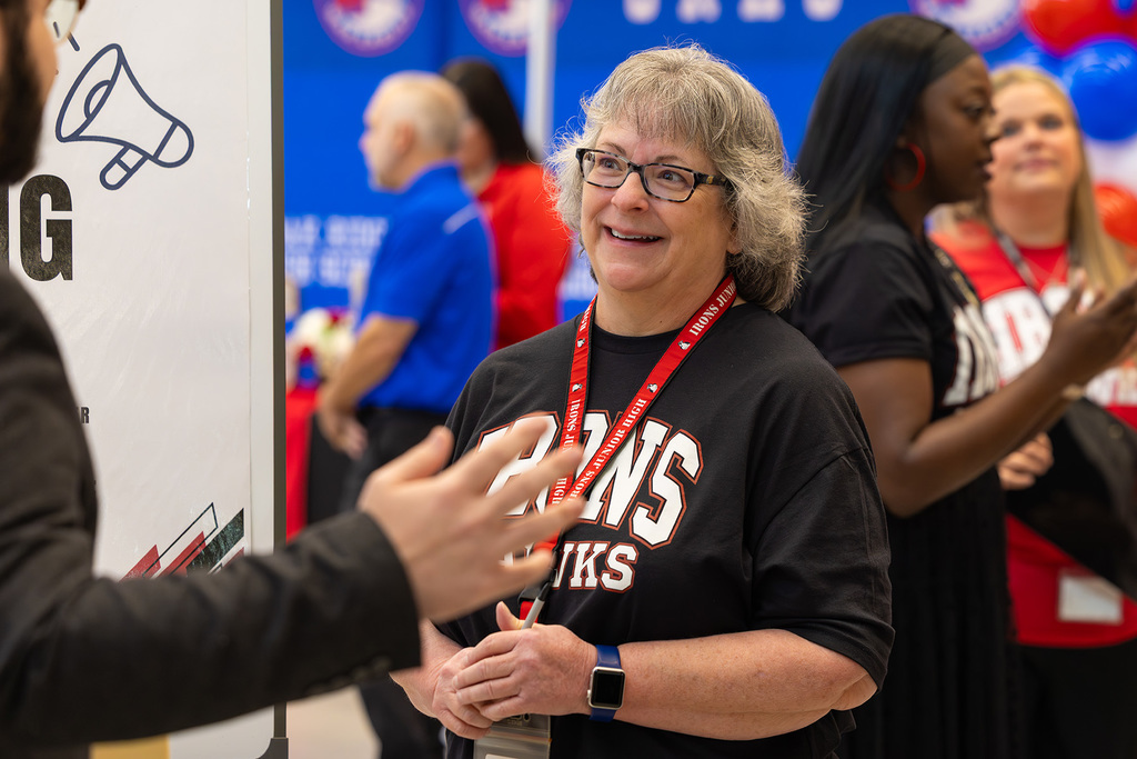 Administrator listening to a potential job candidate.
