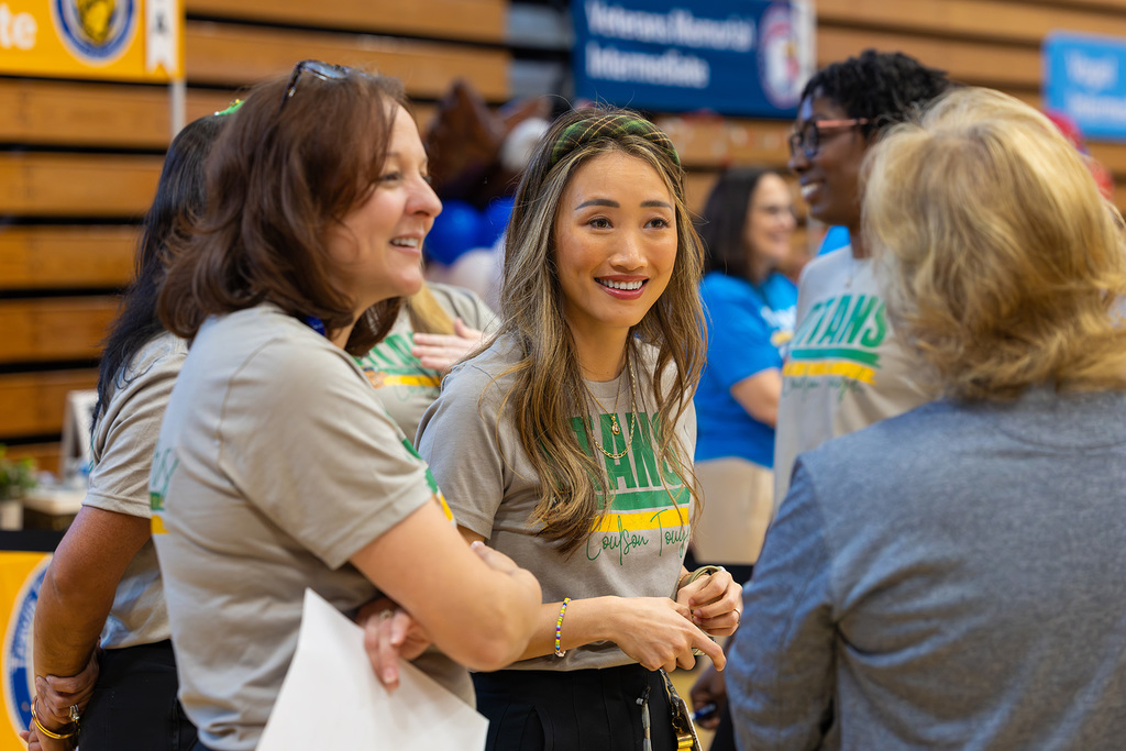 Two administrators listening during a job fair.