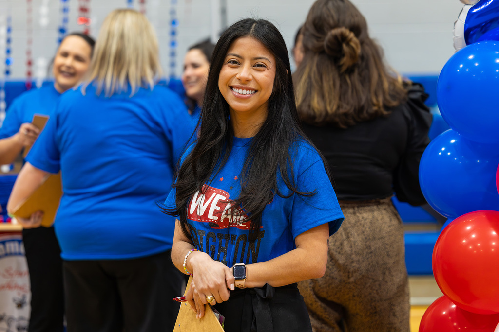 Administrator smiling while waiting for potential job candidates.