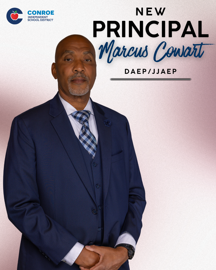 A professionally dressed man stands facing forward in a navy blue suit, vest, and patterned tie, with his hands clasped in front of him. He has a closely shaved head and a neatly trimmed gray goatee, and wears a watch on his wrist. Text on the right reads: “New Principal Marcus Cowart, DAEP/JJAEP.” The district logo appears in the top left.