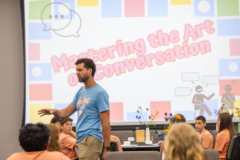 Staff member makes a presentation to students.