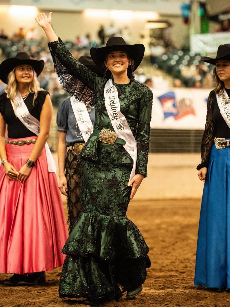 Montgomery County Fair Queen Delaney Miller waves to the crowd.