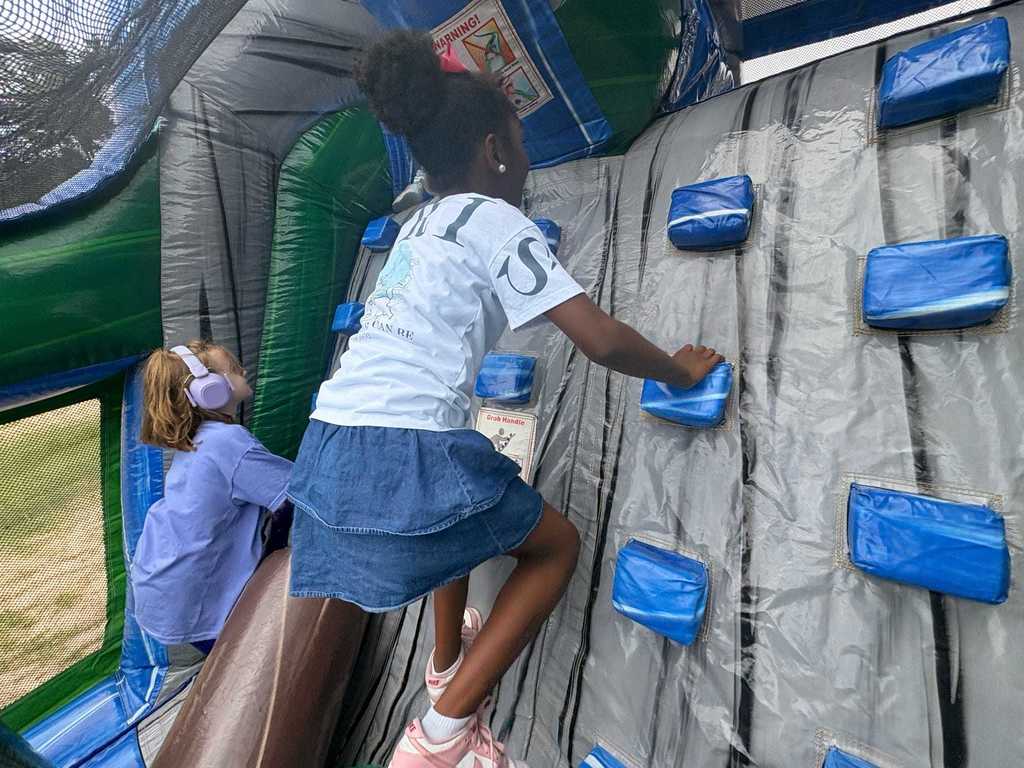 climbing up the bounce house
