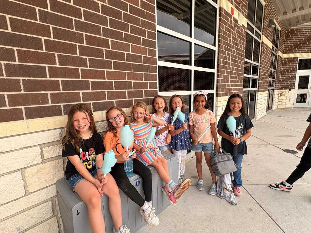 2nd graders enjoying cotton candy