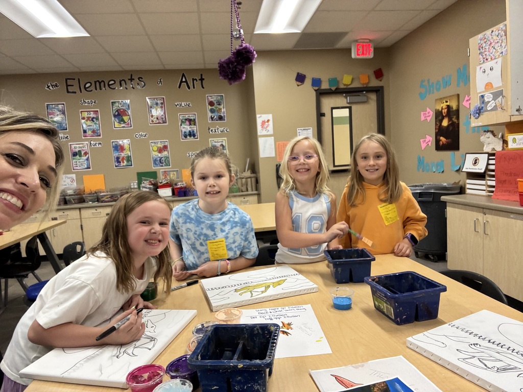 kids and teacher making art work together