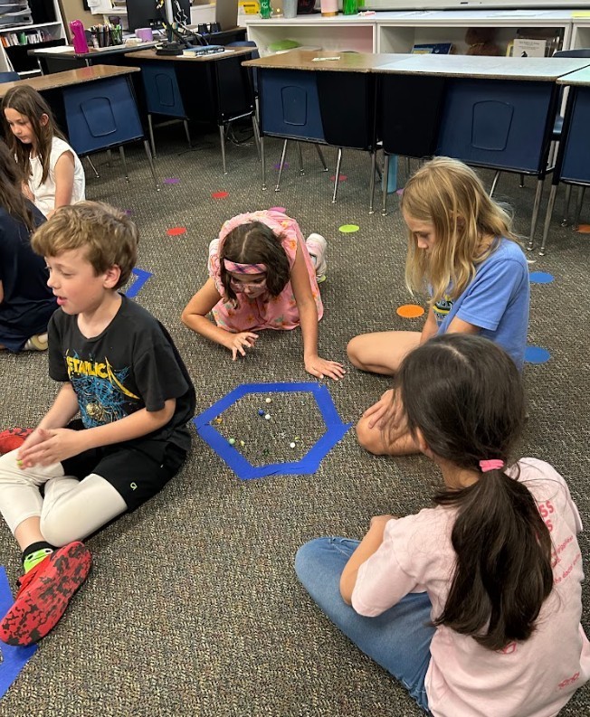 Students playing Marbles 2