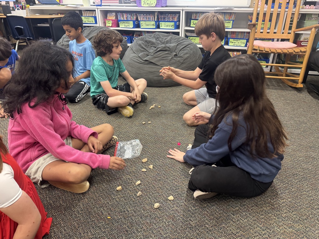 Students playing Jacks
